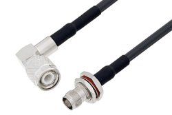 PE3C3658/HS - TNC Male Right Angle to TNC Female Bulkhead Cable Using LMR-195 Coax with HeatShrink